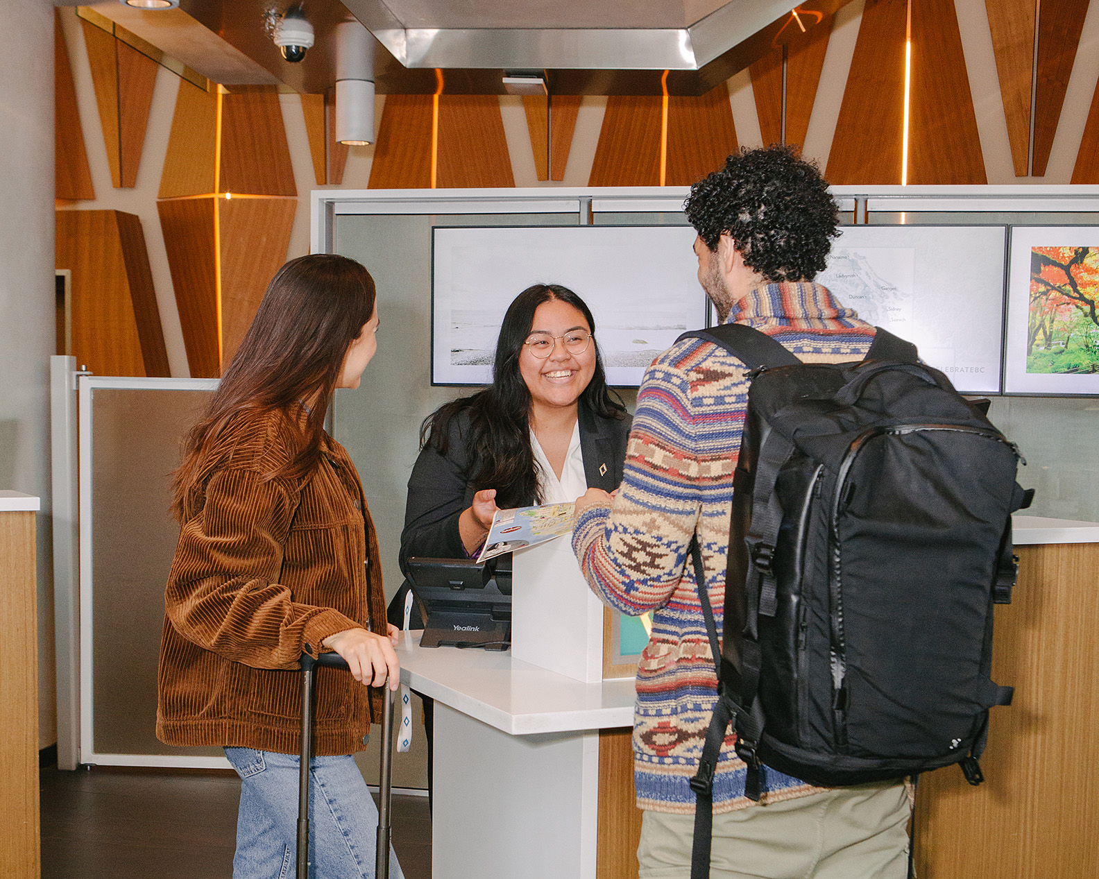 Civic Hotel front desk agent checking in guest Surrey